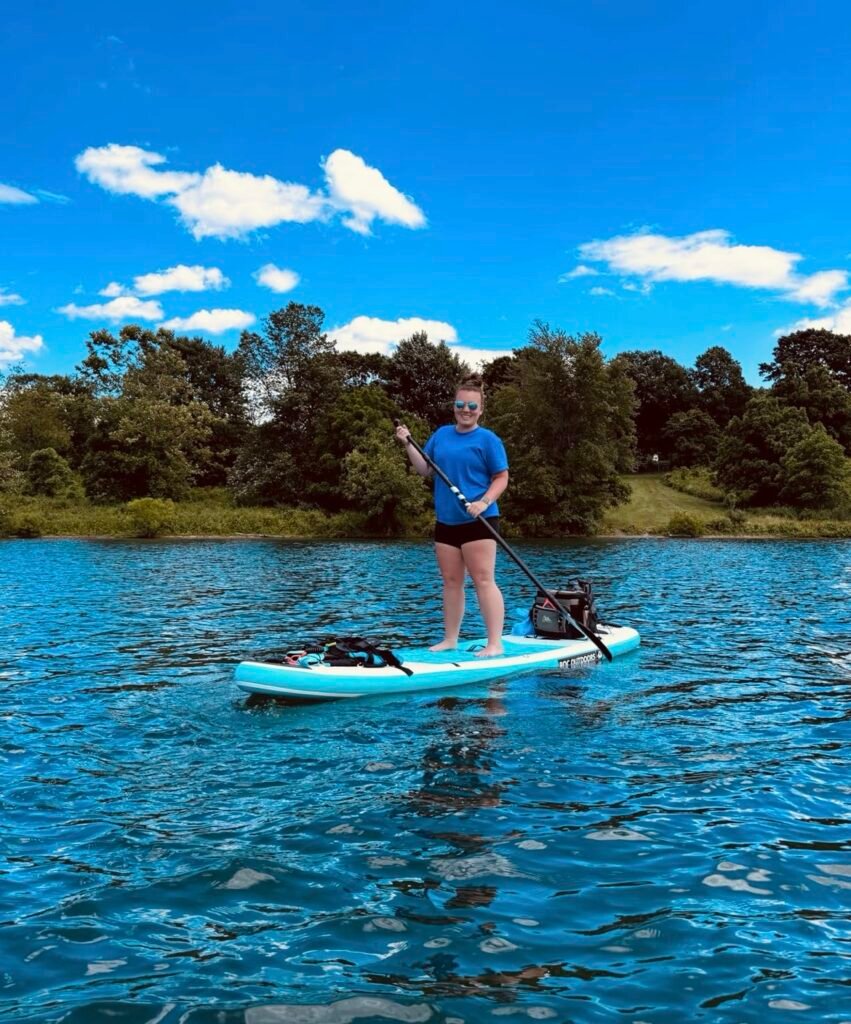Paddle board in lake with inflatable paddle board